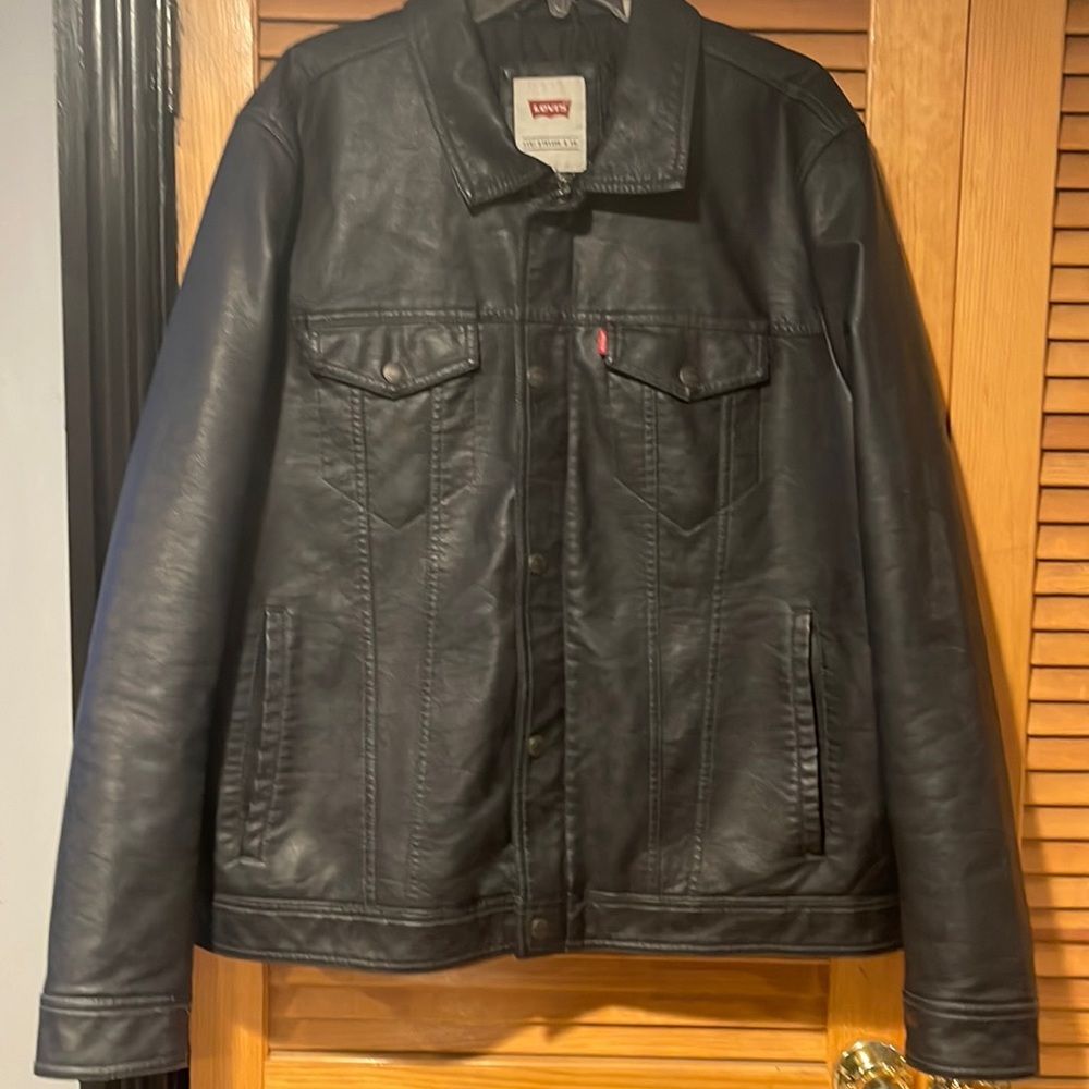 Levi’s XL faux leather navy blue quilt lined trucker jacket.